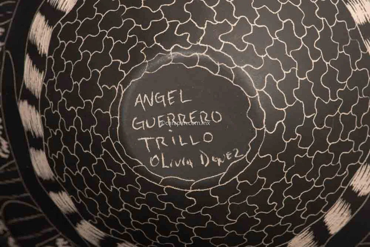 Mata Ortiz Pot With Etched Animals in Black Over Beige