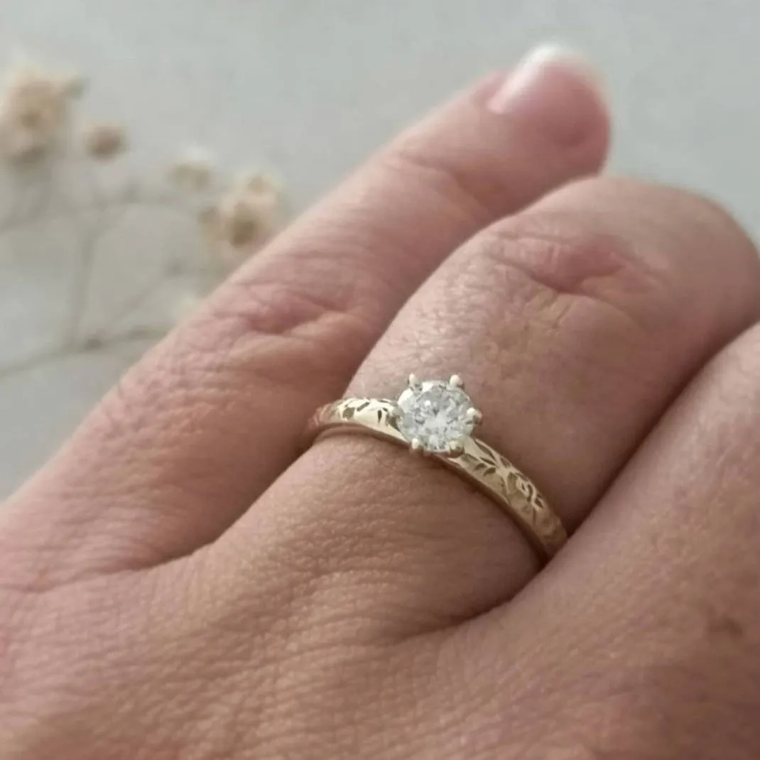 Solitaire diamond floral engagement ring
