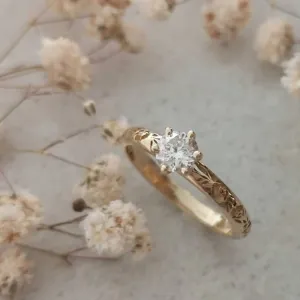 Solitaire diamond floral engagement ring