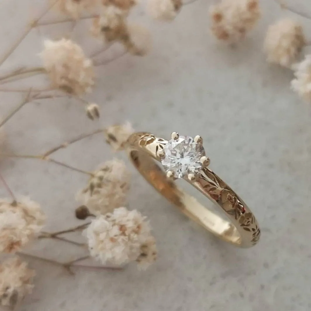 Solitaire diamond floral engagement ring