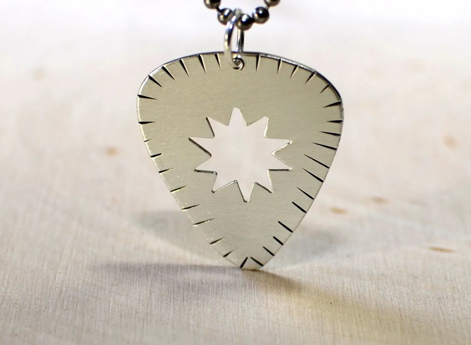 Sterling silver guitar pick necklace