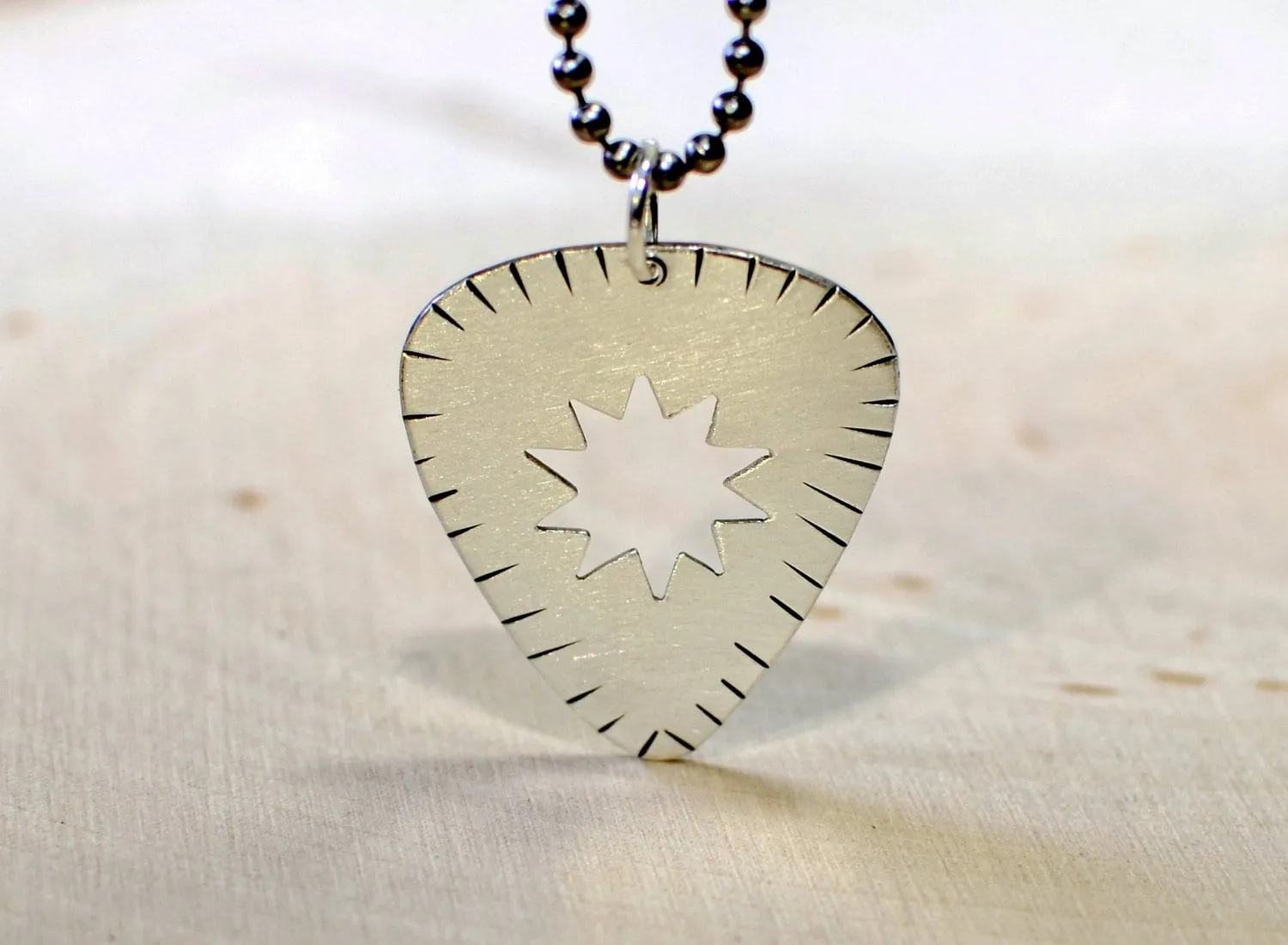 Sterling silver guitar pick necklace
